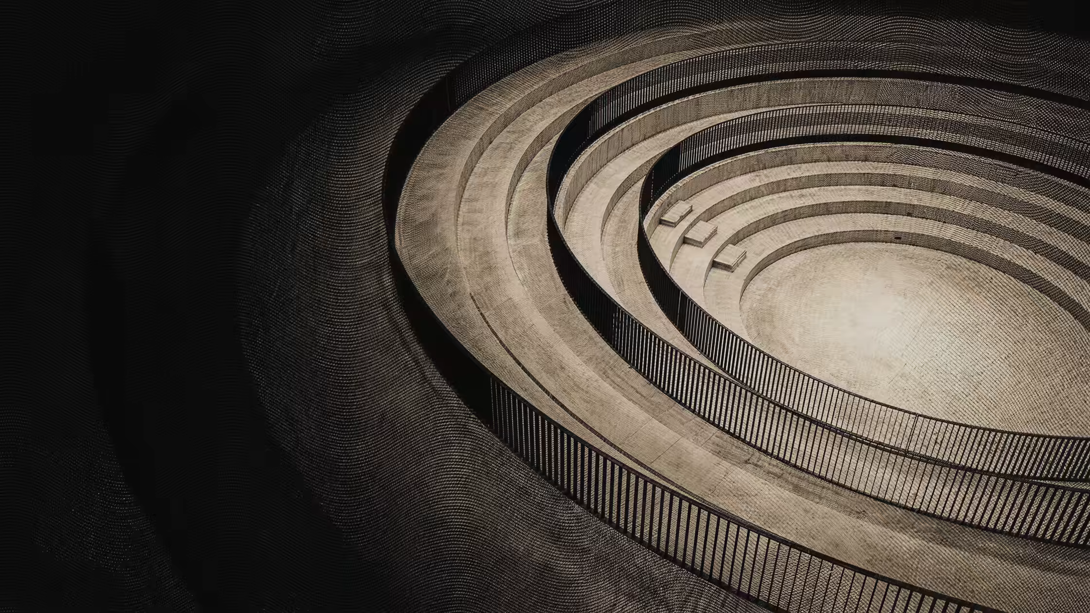 Grabado: un anfiteatro en espiral visto desde arriba.